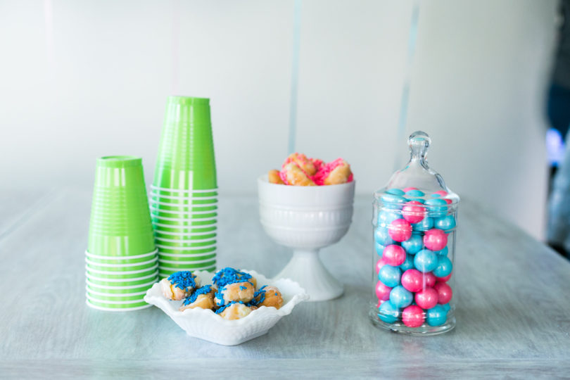 Sprinkled donut holes are such a simple treat for a dessert table! Most places will add the sprinkles for free! - Gender Reveal Party Ideas by Utah mom blogger By Jen Rose